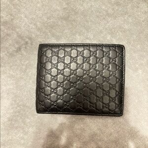 Men’s Gucci monogram wallet